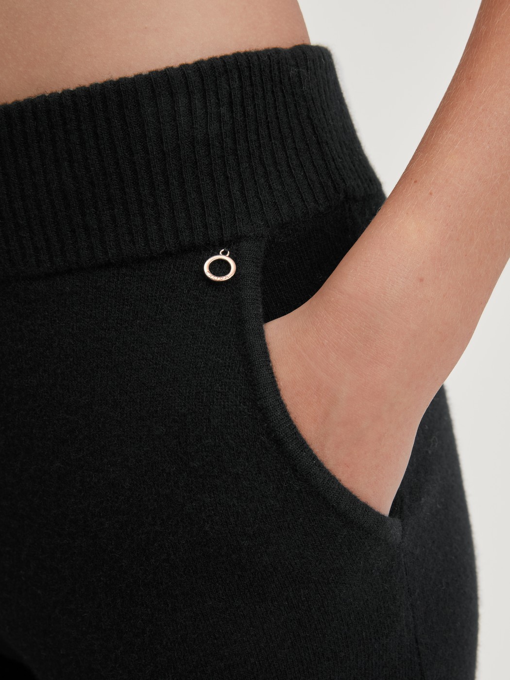 Women model is wearing Merino wool knitted trousers made of Wool in Black, Unicoloured from the The Cosy Collection series by CALIDA, Detail