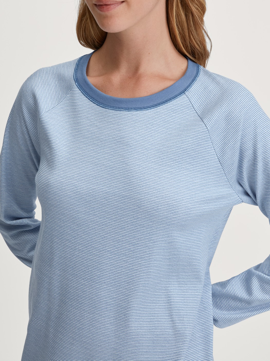 Women model is wearing Long Sleeve Nightdress – 110 cm Length made of 100% Cotton in Blue, Striped from the Midnight Stripes series by CALIDA, Detail