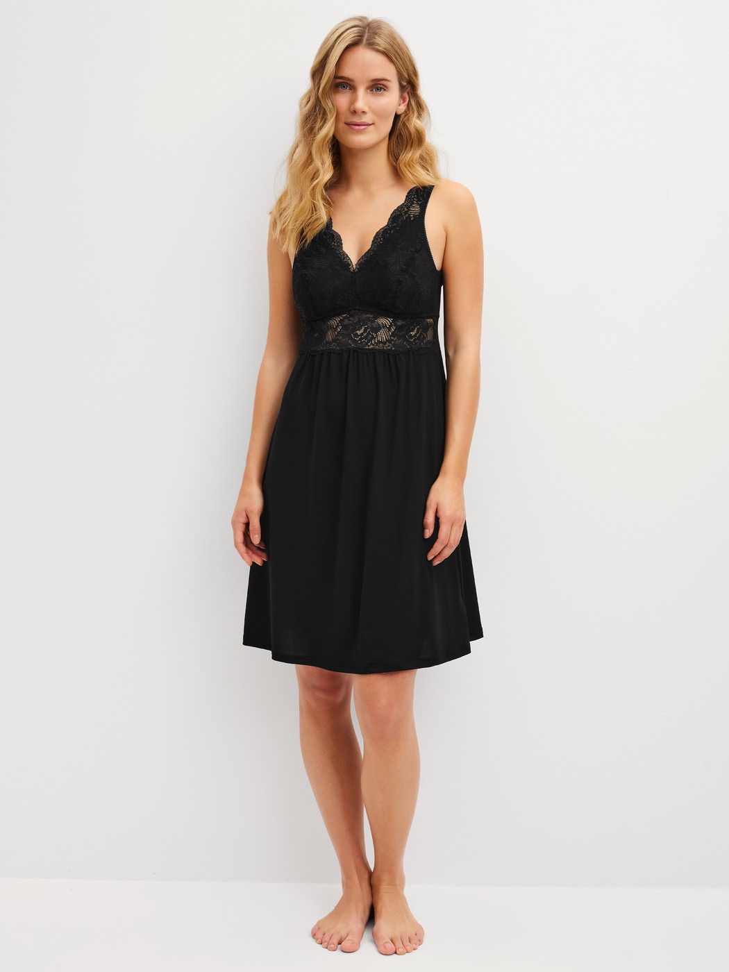 Women model is wearing Nightdress, length 95 cm made of Modal in Black, Lace from the Elegant Dreams series by CALIDA, Front view