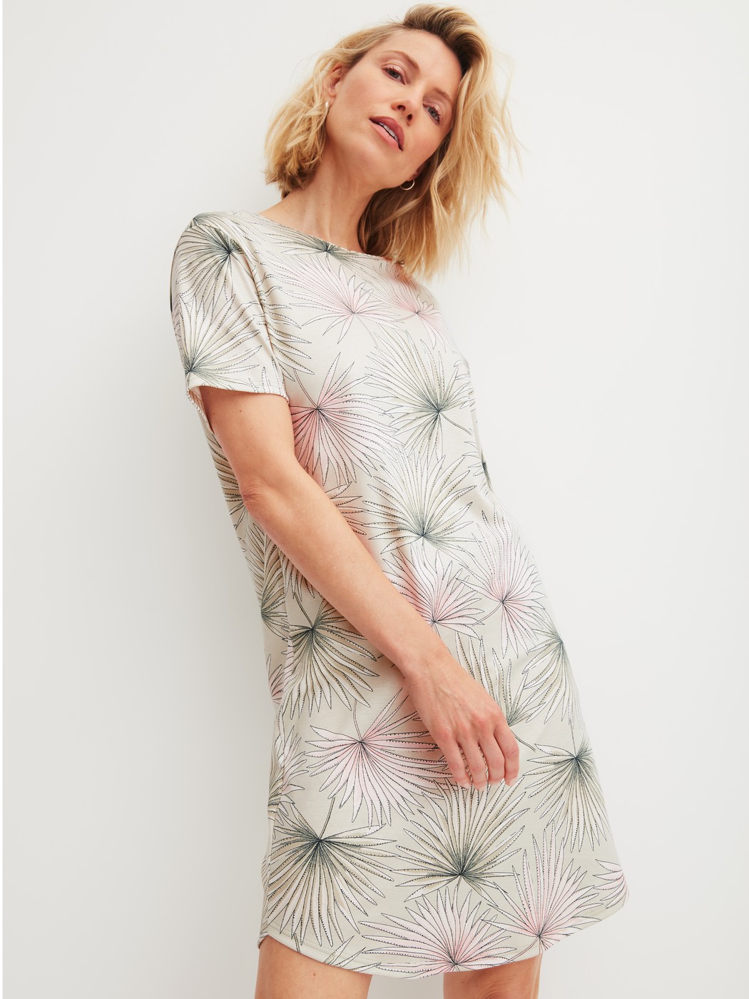 Women model is wearing Short-sleeved nightdress, length 95 cm made of 100% Cotton in Green, Floral from the Leaf Dreams series by CALIDA, Front view