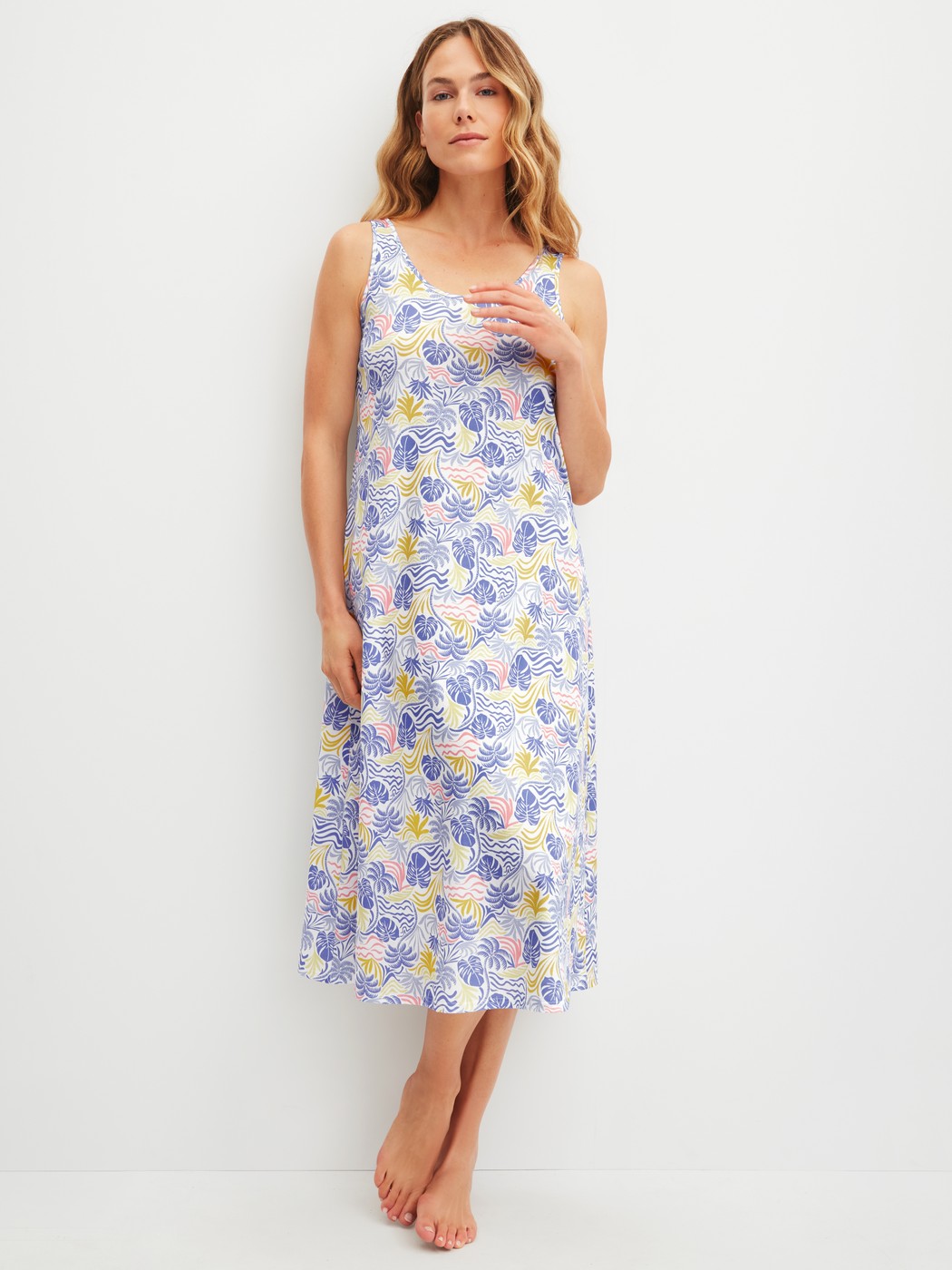 Women model is wearing Nightdress, length 125 cm made of 100% Cotton in Blue, Floral from the Coastal Dreams series by CALIDA, Front view