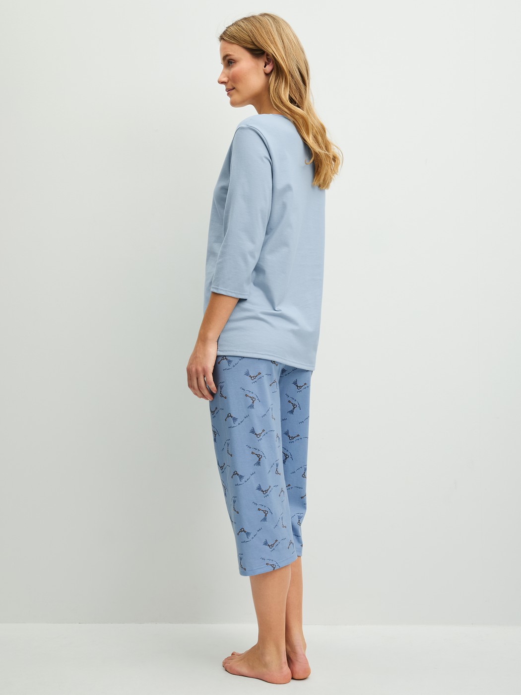 Women model is wearing  made of 100% Cotton in Blue, Patterned from the Hotel Nights series by CALIDA, Back view