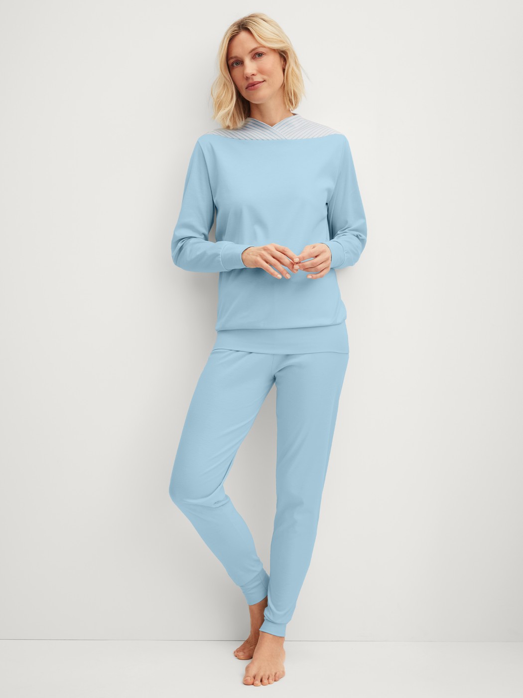 Women model is wearing Pyjama with cuff made of 100% Cotton in Blue, Unicoloured from the Season Special series by CALIDA, Front view