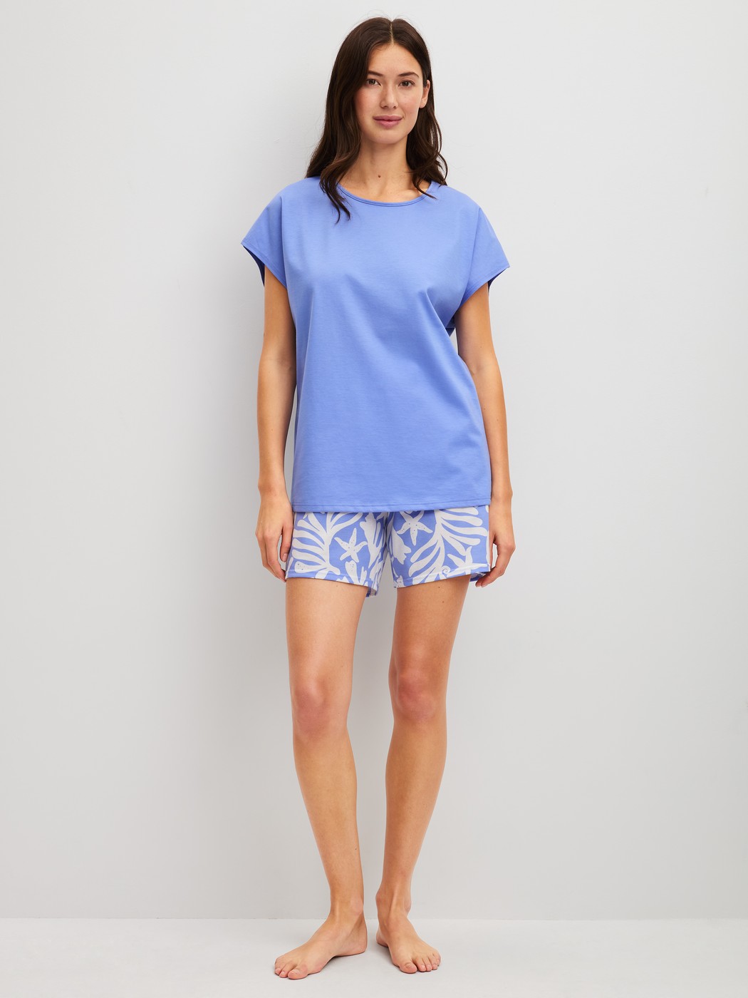 Women model is wearing Short pyjama made of 100% Cotton in Blue, Floral from the Cotton Special series by CALIDA, Front view