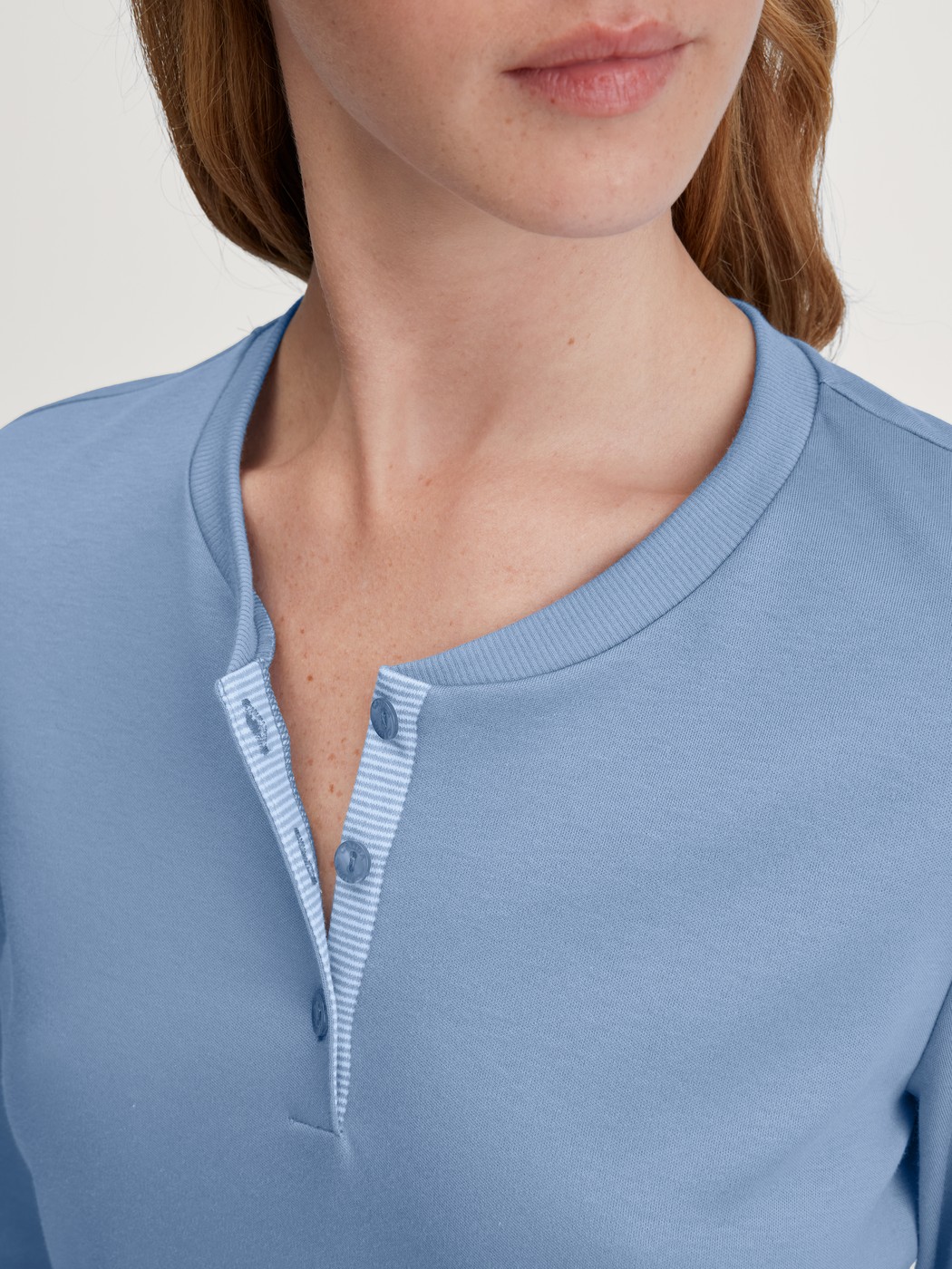 Women model is wearing Pyjamas, long made of 100% Cotton in Blue, Striped from the Midnight Stripes series by CALIDA, Detail