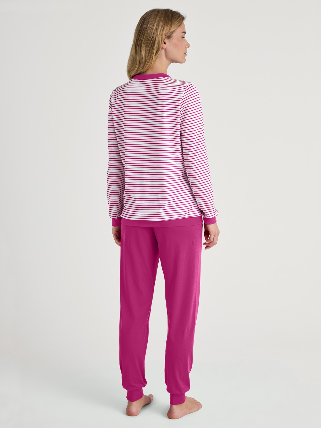 Women model is wearing Pyjama with cuff made of 100% Cotton in Pink, Patterned from the Cotton Special series by CALIDA, Back view