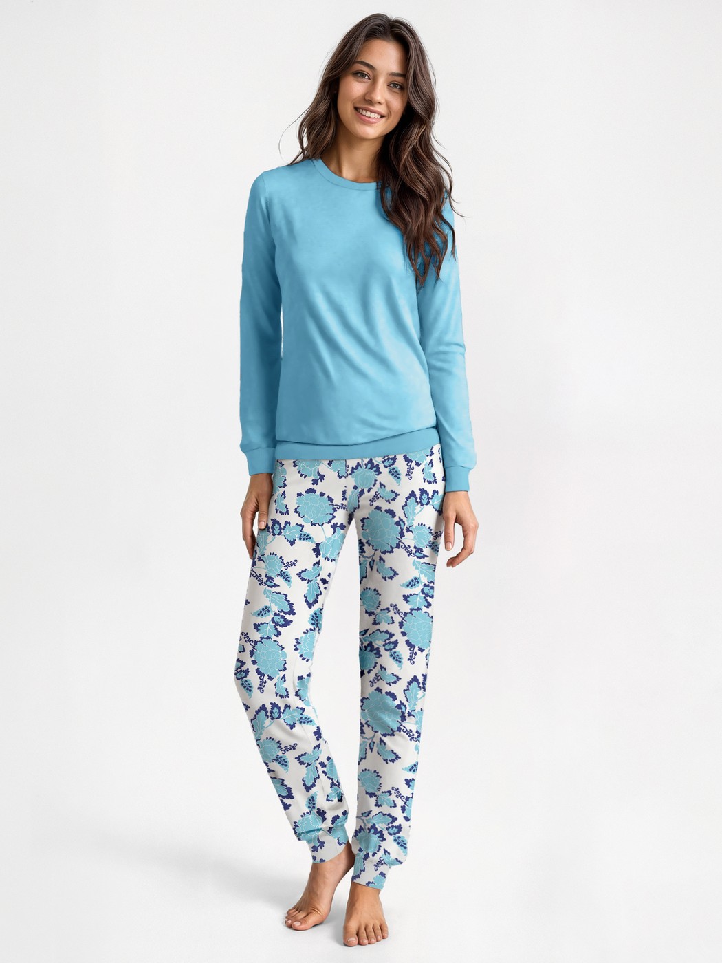 Women model is wearing Pyjama with cuff made of 100% Cotton in Turquoise, Floral from the Nightwear Xtra series by CALIDA, Front view