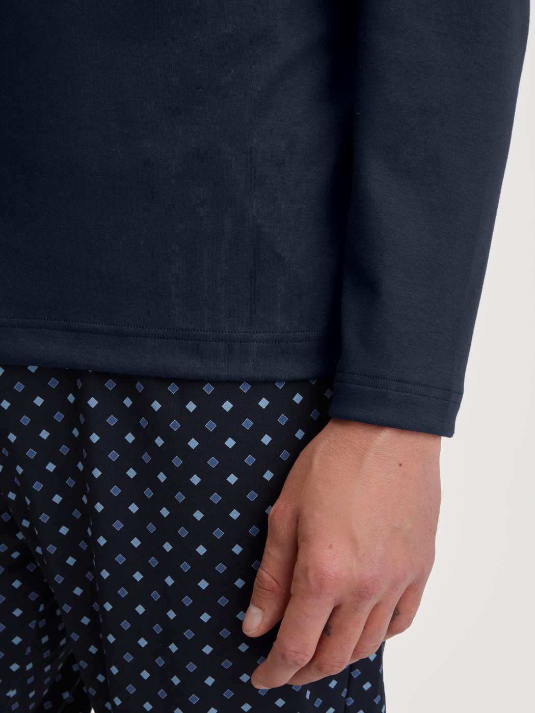 Men model is wearing Pyjamas, long made of 100% Cotton in Blue, Patterned from the Relax Streamline series by CALIDA, Detail