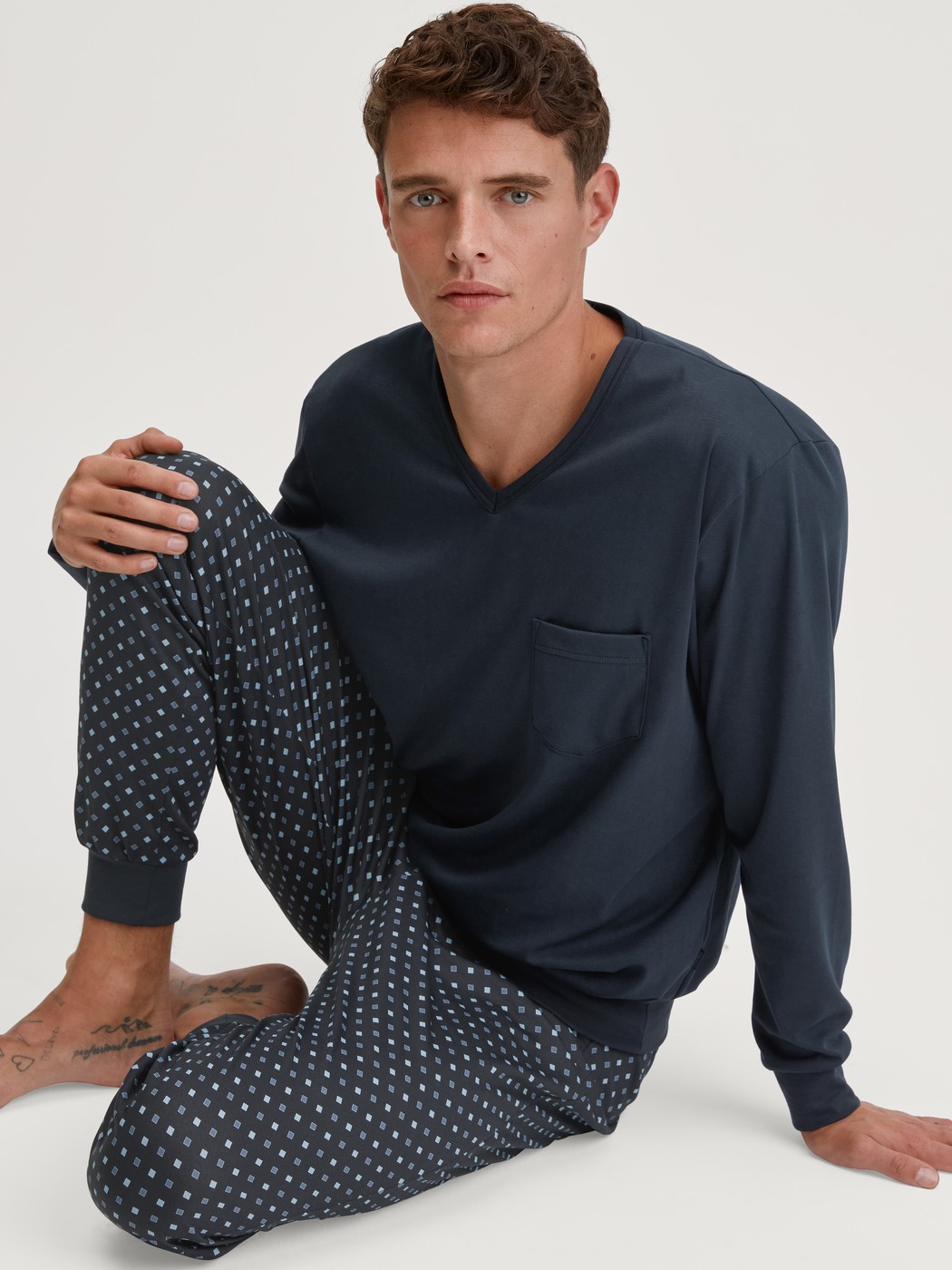 Men model is wearing Pyjama with cuff made of 100% Cotton in Blue, Patterned from the Relax Streamline series by CALIDA, Additional Image