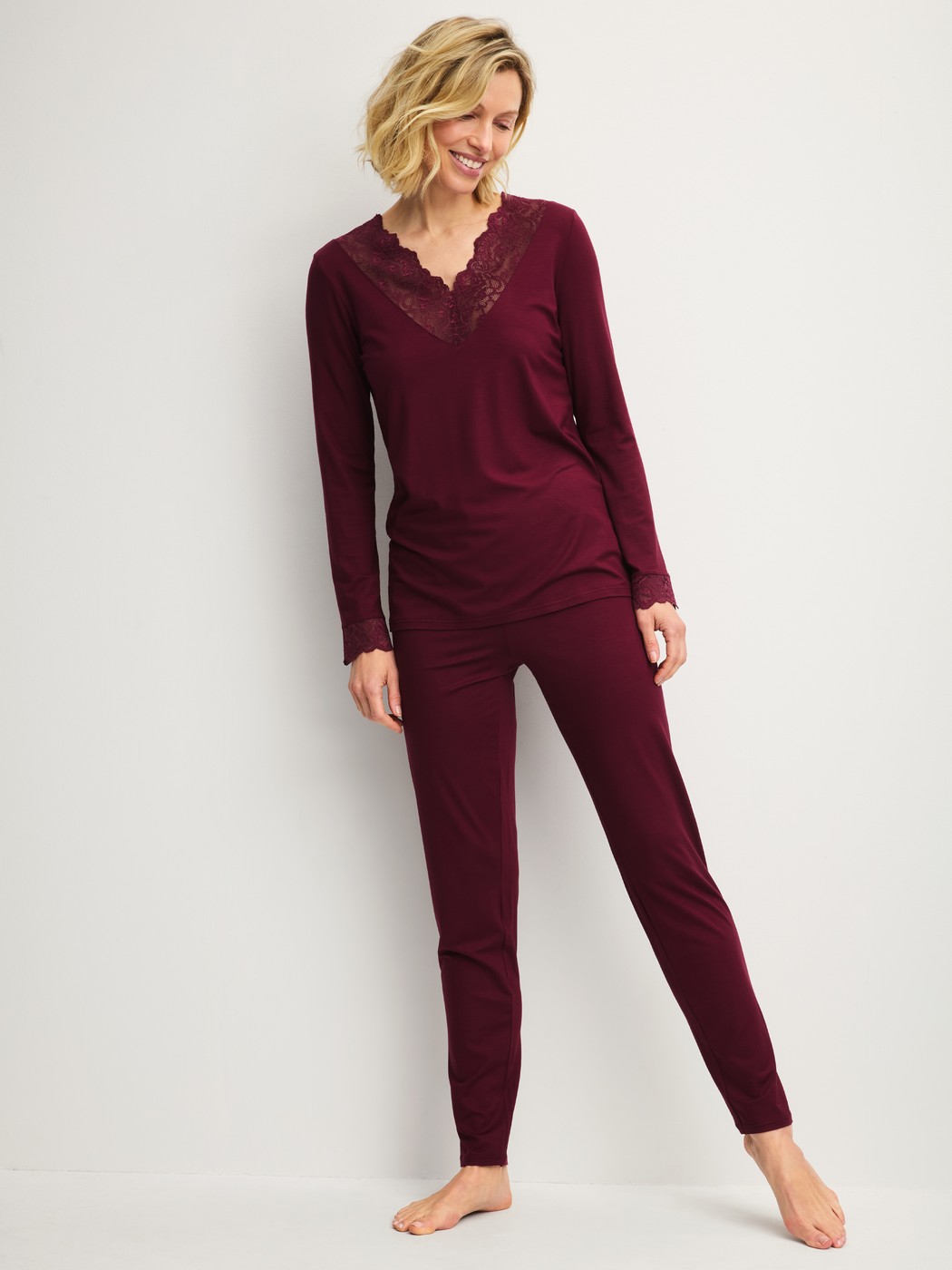 Women model is wearing Pyjamas, long made of Modal in Red, Lace from the Season Special series by CALIDA, Front view