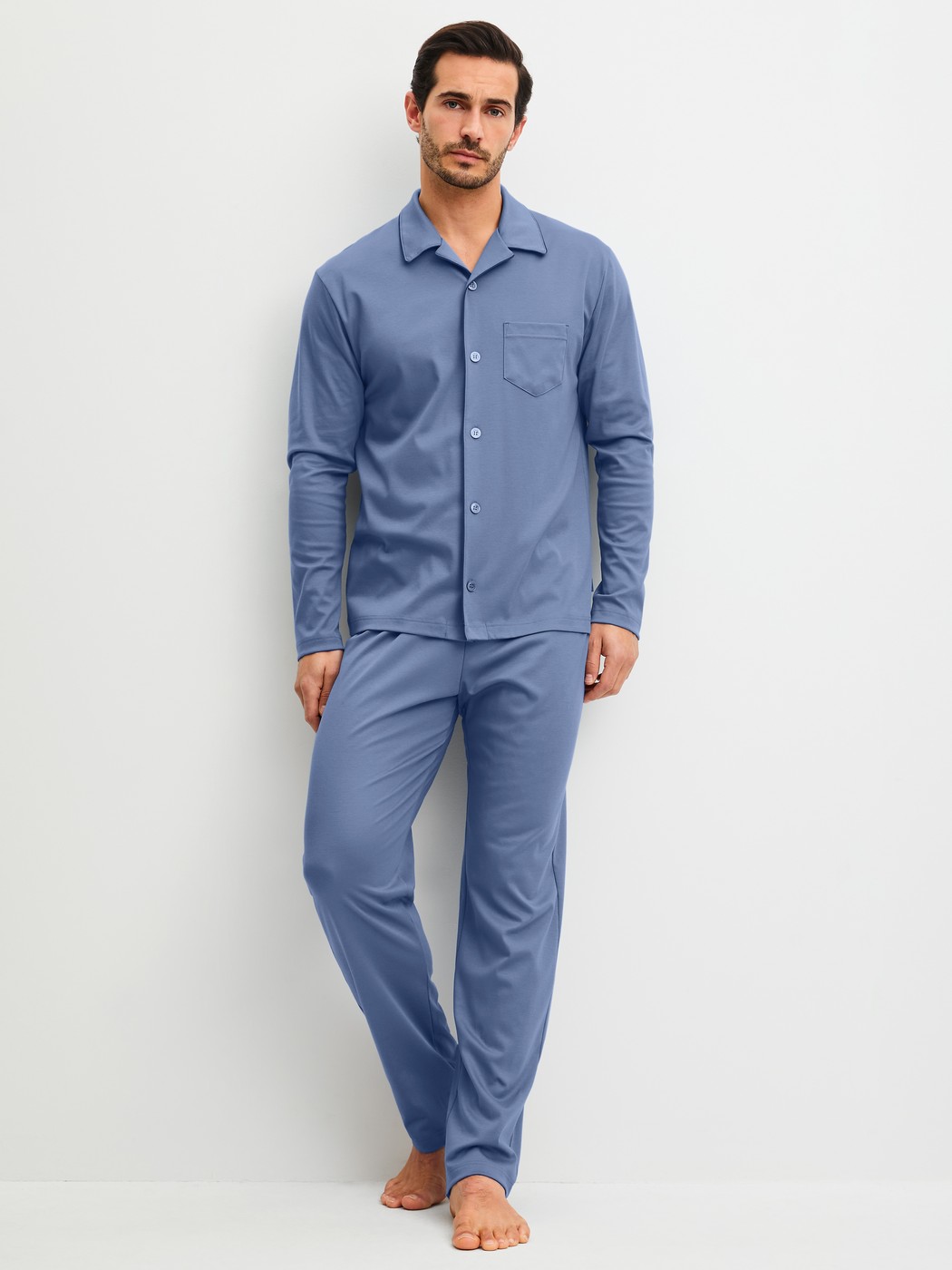 Men model is wearing Pyjamas with buttons made of 100% Cotton in Blue, Unicoloured from the Relax Choice 1 series by CALIDA, Front view