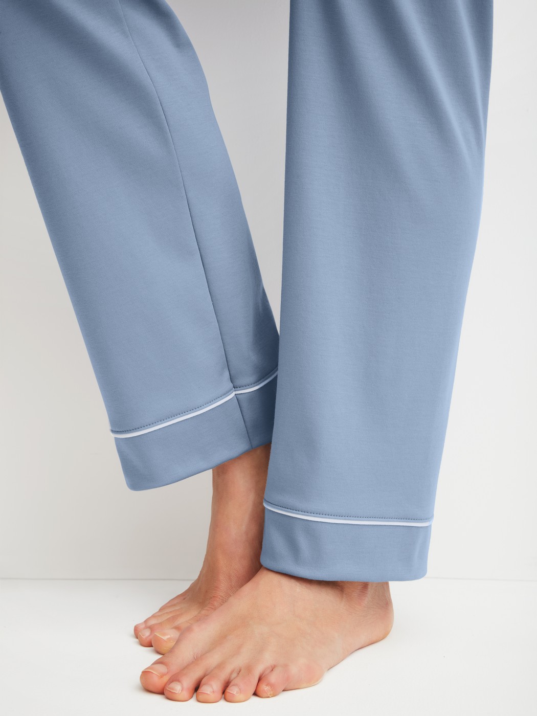 Women model is wearing Button-Up Pyjama made of 100% Cotton in Blue, Unicoloured from the Night Lovers series by CALIDA, Detail