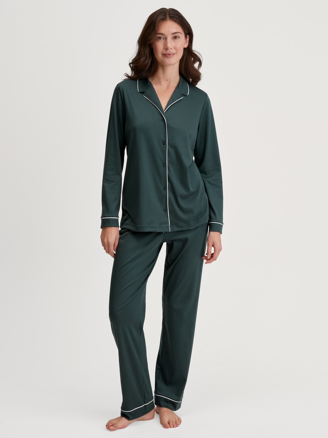 Women model is wearing Button-Up Pyjama made of 100% Cotton in Green, Unicoloured from the Night Lovers series by CALIDA, Front view