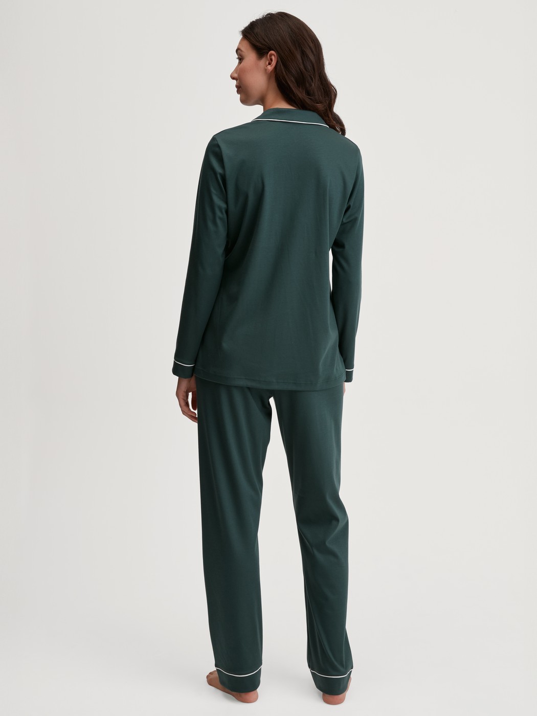 Women model is wearing Button-Up Pyjama made of 100% Cotton in Green, Unicoloured from the Night Lovers series by CALIDA, Back view