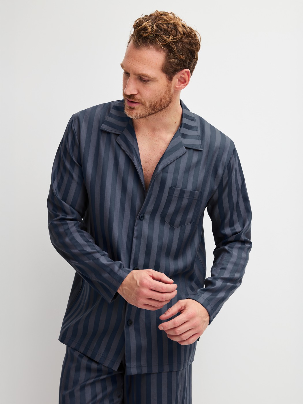 Men model is wearing Pyjamas, long made of Lyocell in Grey, Striped from the Relax Lux series by CALIDA, Front view