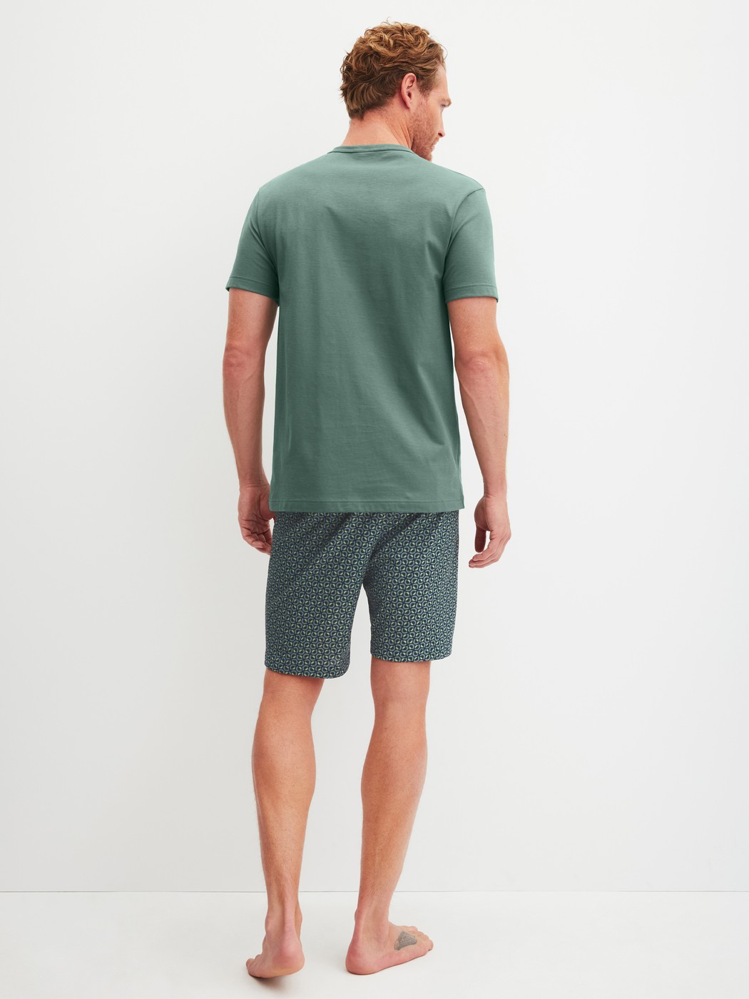 Men model is wearing Short pyjama made of 100% Cotton in Green, Patterned from the Cotton Special series by CALIDA, Back view