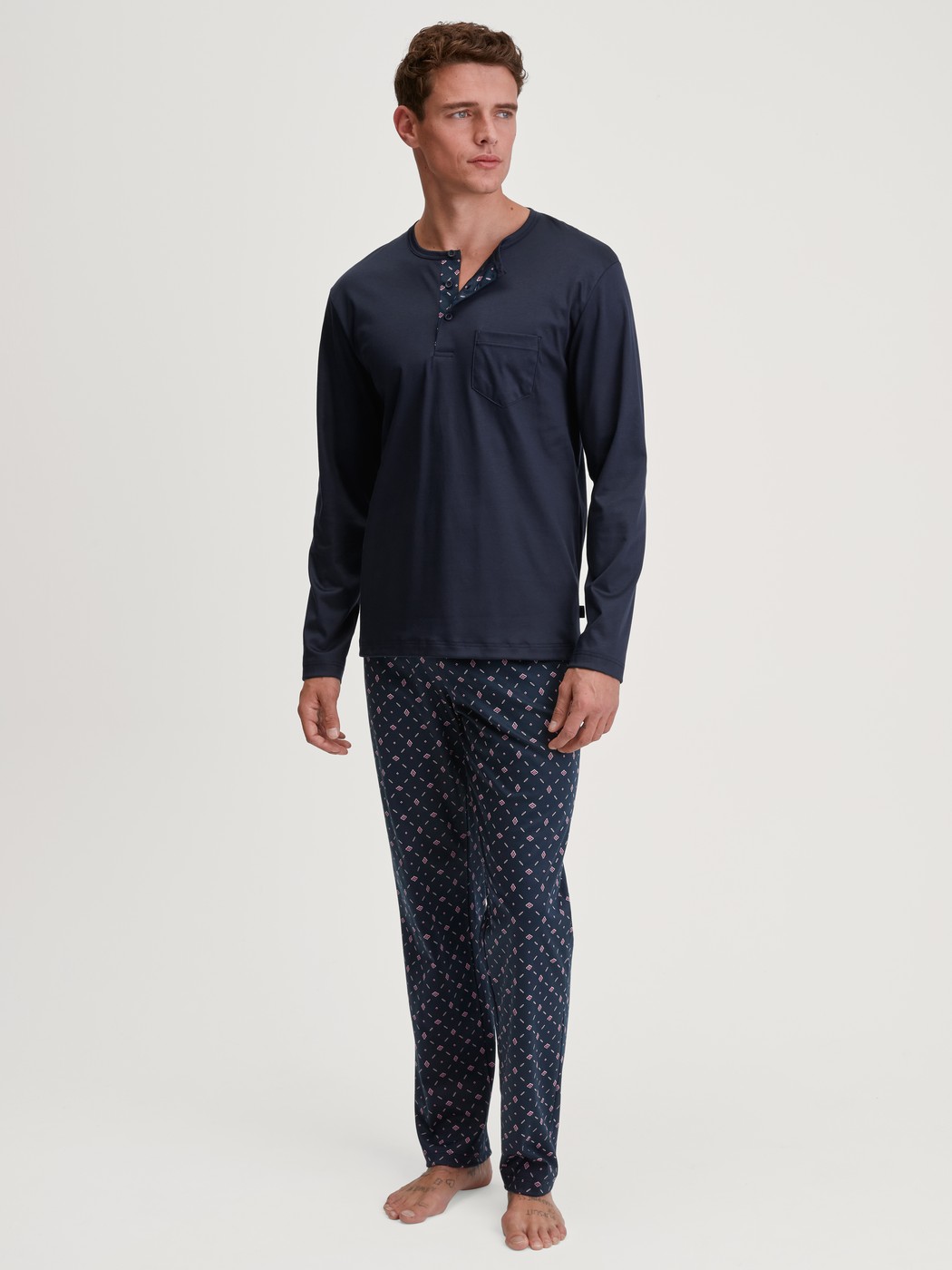 Men model is wearing Pyjamas, long made of 100% Cotton in Blue, Patterned from the Relax Selected 4 series by CALIDA, Front view