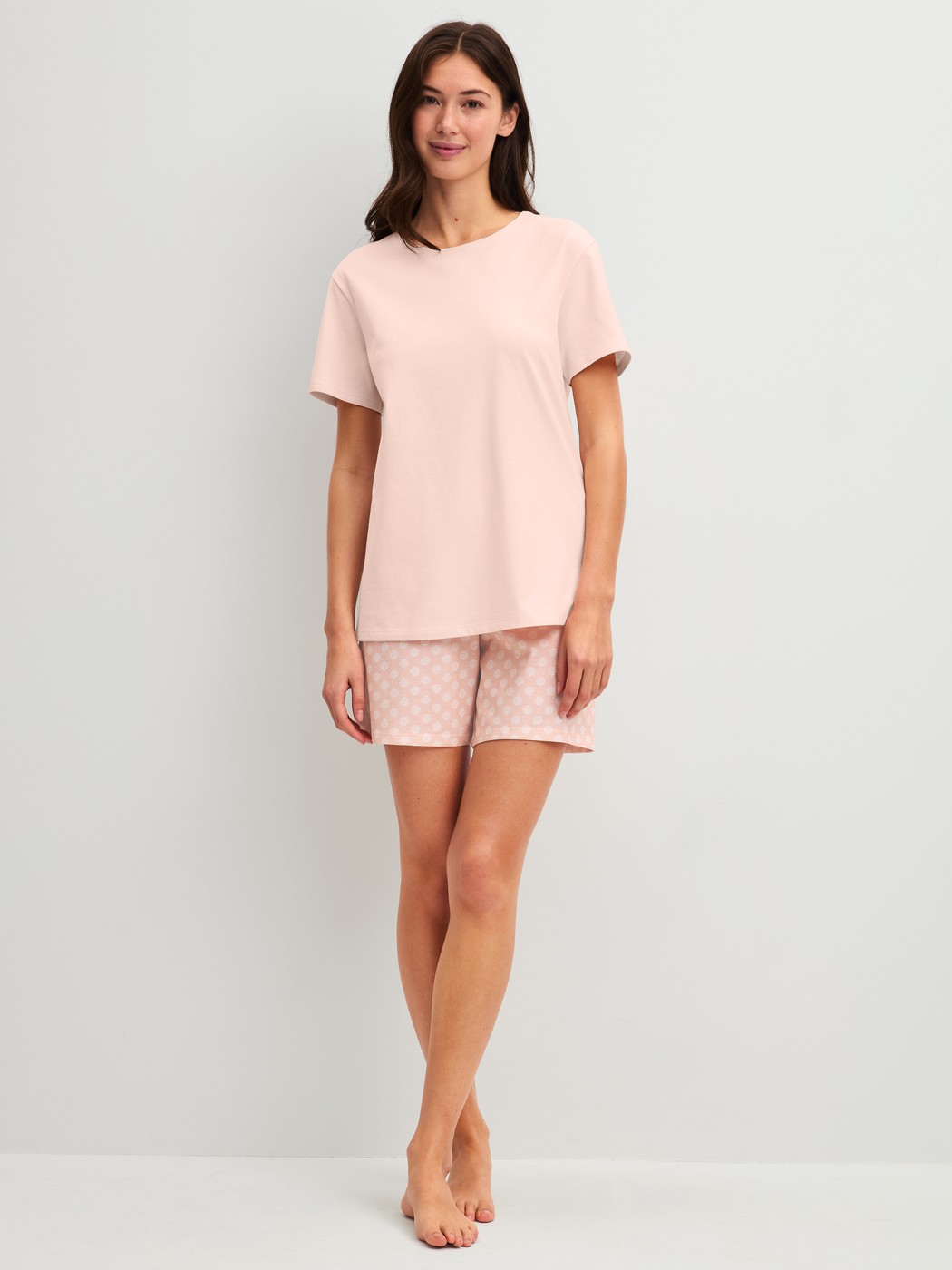 Women model is wearing Short pyjama made of 100% Cotton in Pink, Patterned from the Easter Nights series by CALIDA, Front view