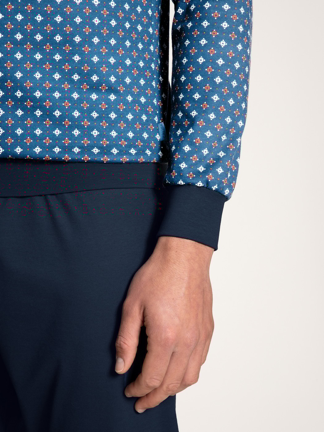 Men model is wearing Pyjama with cuff made of 100% Cotton in Blue, Patterned from the Nightwear Xtra series by CALIDA, Detail