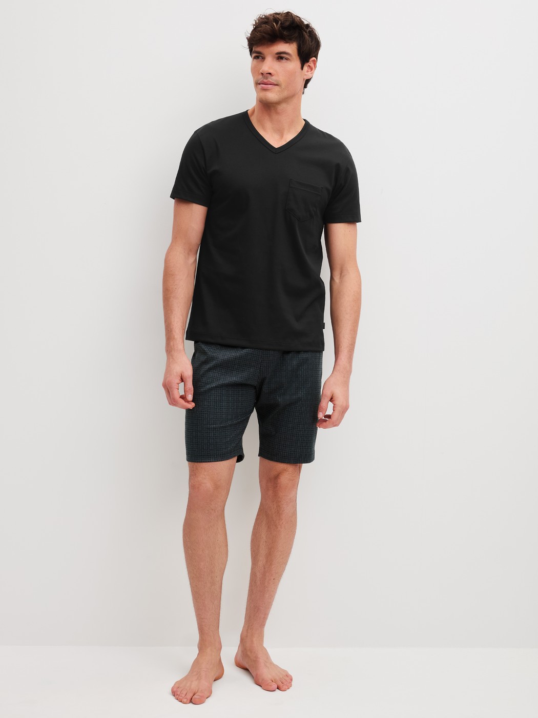 Men model is wearing Short pyjamas made of 100% Cotton in Black, Patterned from the Relax Streamline 2 series by CALIDA, Front view