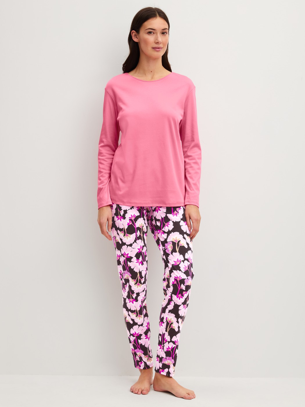 Women model is wearing Pyjamas, long made of 100% Cotton in Pink, Floral from the Autumn Dreams series by CALIDA, Front view