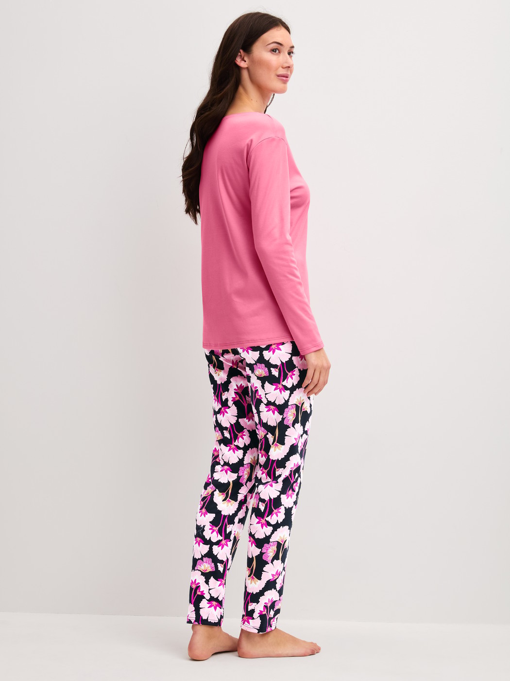 Women model is wearing Pyjamas, long made of 100% Cotton in Pink, Floral from the Autumn Dreams series by CALIDA, Back view