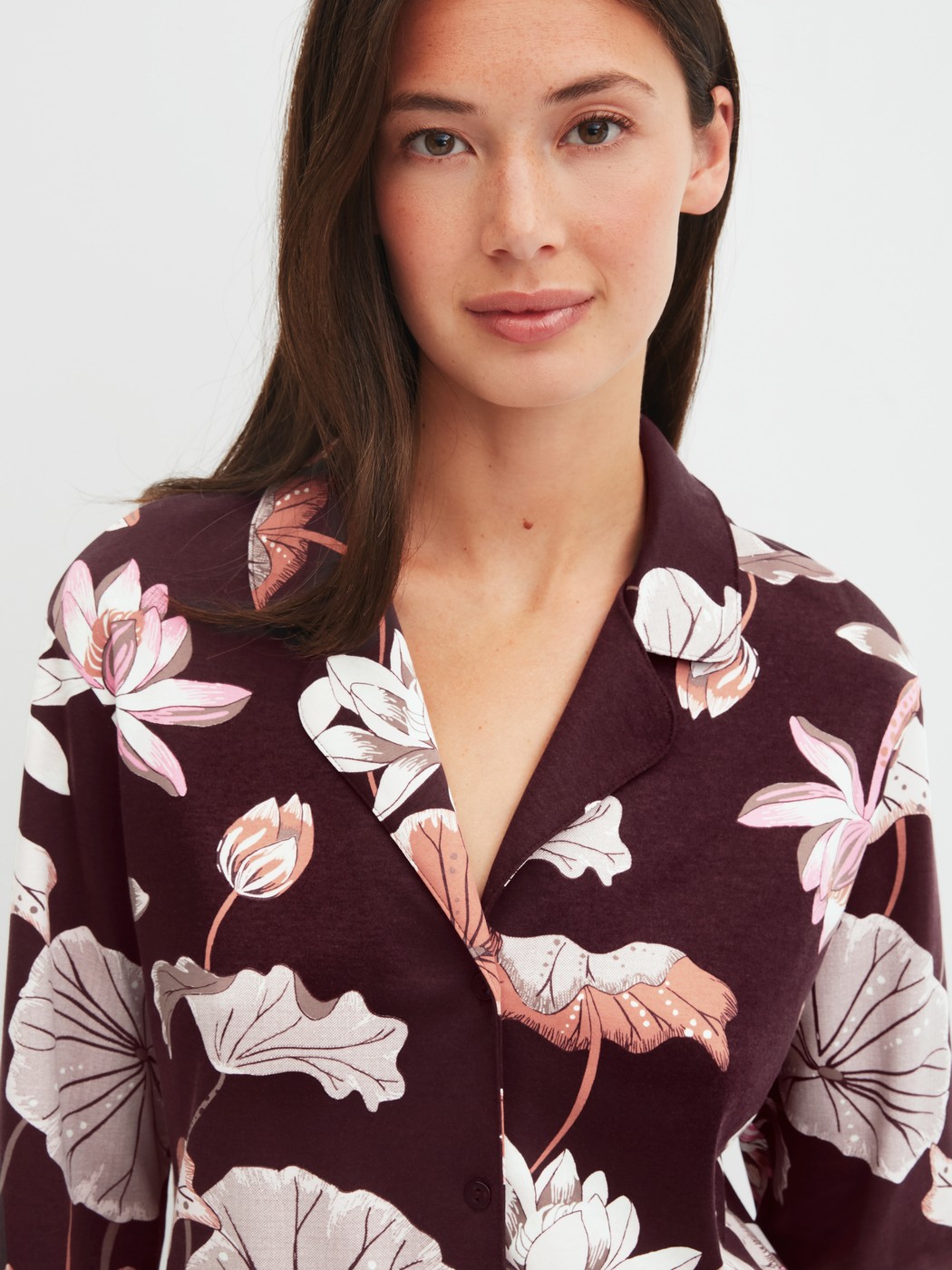 Women model is wearing Button-Up Pyjama made of 100% Cotton in Red, Floral from the Season Special series by CALIDA, Detail