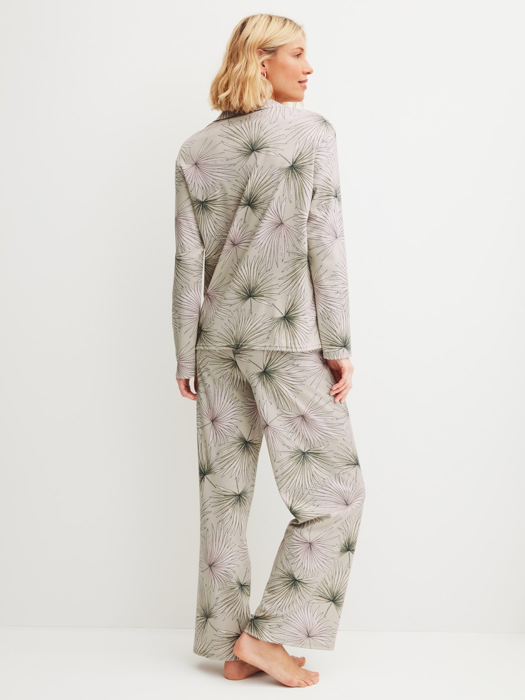 Women model is wearing Button-Up Pyjama made of 100% Cotton in Green, Floral from the Leaf Dreams series by CALIDA, Back view