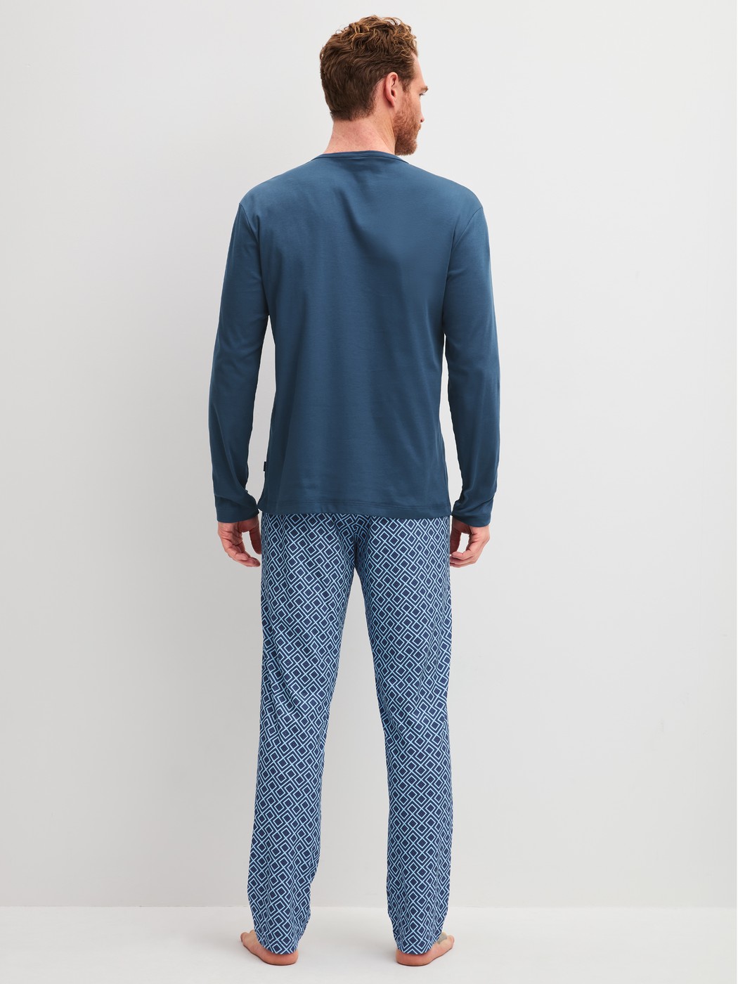 Men model is wearing Pyjamas, long made of 100% Cotton in Blue, Checked from the Relax Streamline 2 series by CALIDA, Back view