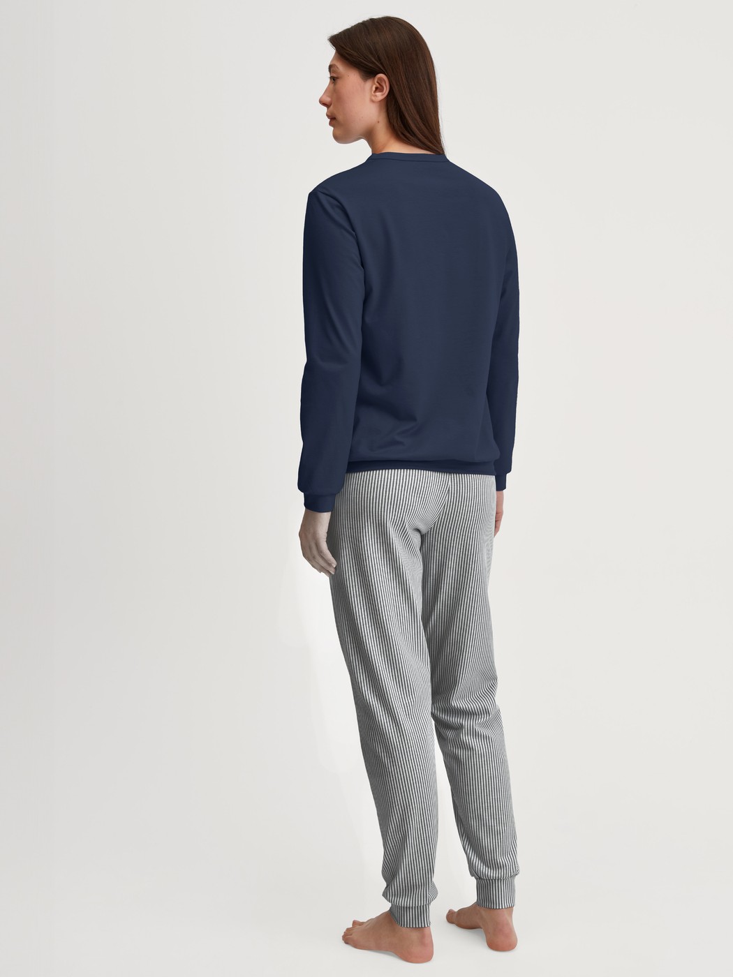 Women model is wearing Pyjama with cuff made of 100% Cotton in Blue, Patterned from the Cotton Special series by CALIDA, Back view