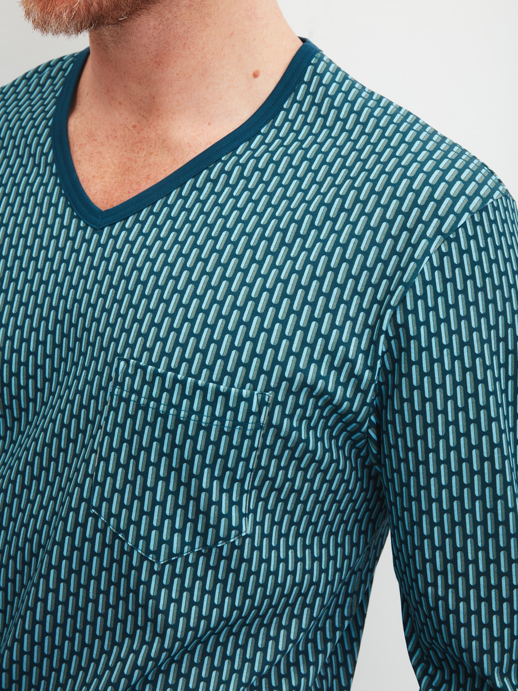 Men model is wearing Pyjama with cuff made of 100% Cotton in Turquoise, Patterned from the Relax Streamline 1 series by CALIDA, Detail