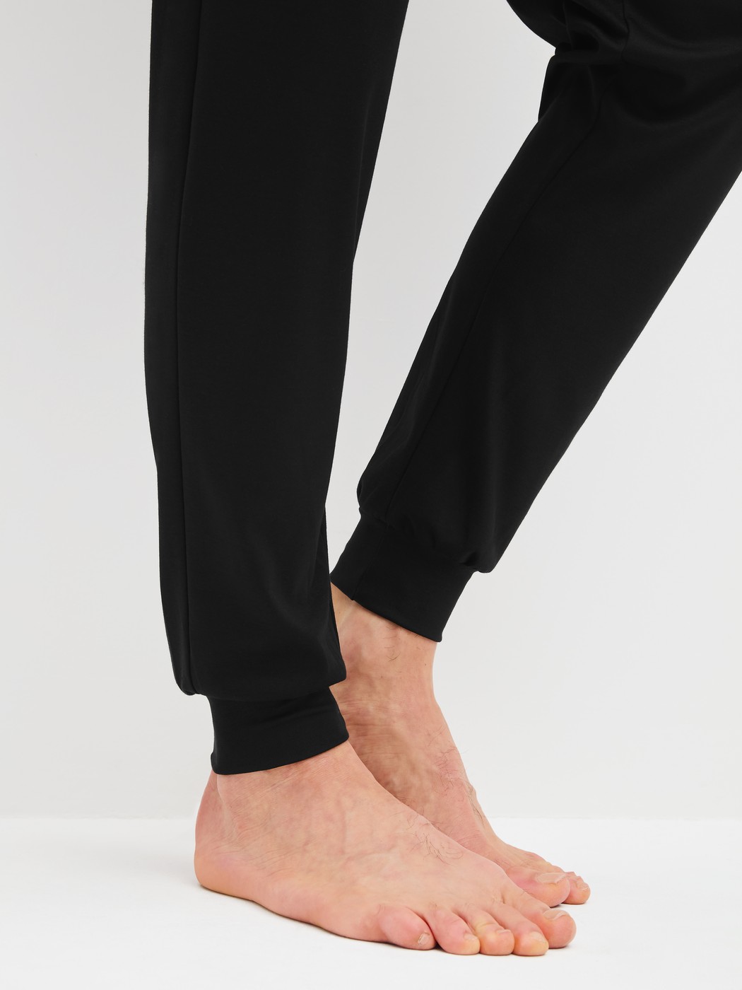 Men model is wearing Pyjama with cuff made of 100% Cotton in Black, Patterned from the Relax Streamline 2 series by CALIDA, Detail