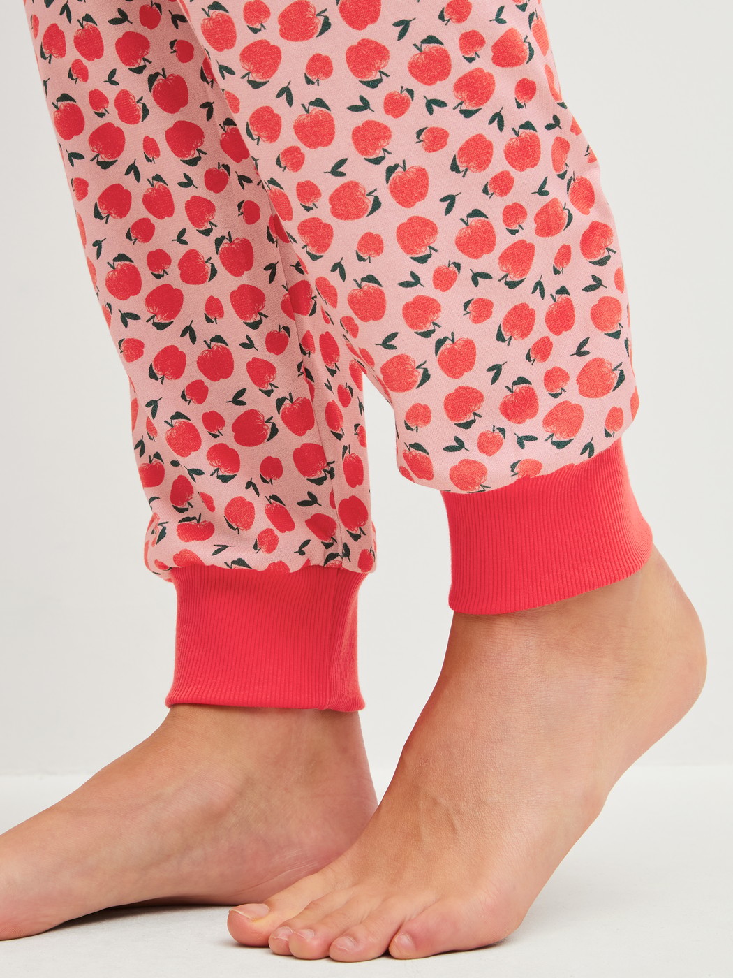 Women model is wearing Pyjama with cuff made of 100% Cotton in Red, Patterned from the Fruity Dreams series by CALIDA, Detail
