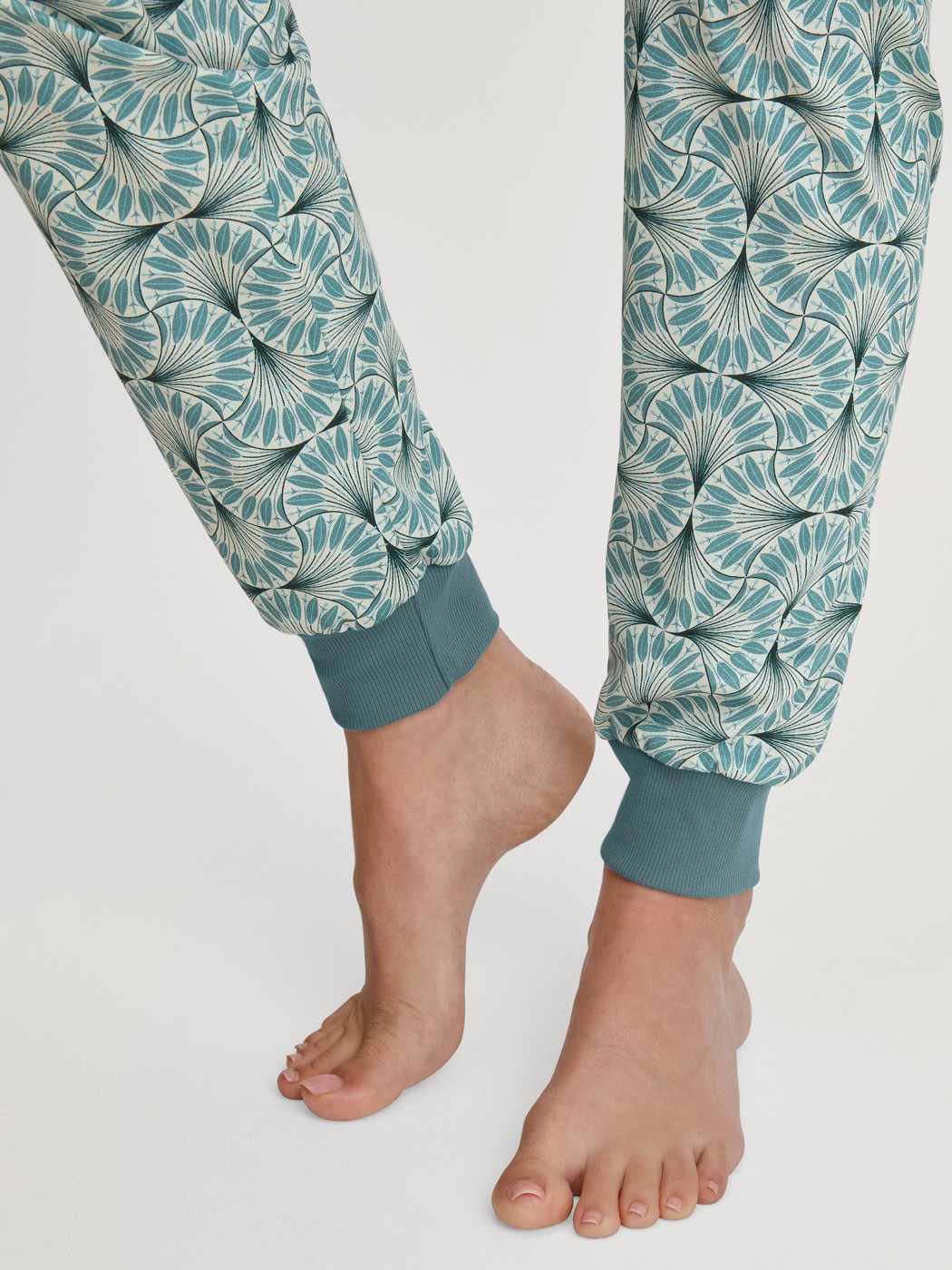 Women model is wearing Pyjama with cuff made of 100% Cotton in Blue, Patterned from the Ornament Nights series by CALIDA, Detail