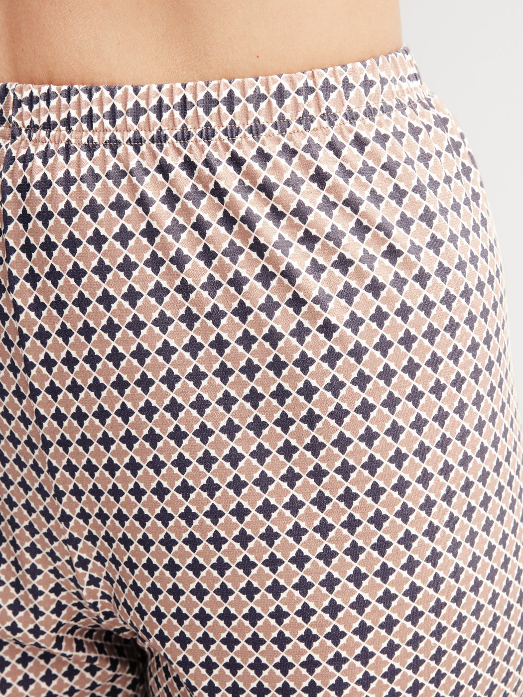 Women model is wearing Pyjama with cuff made of 100% Cotton in Blue, Patterned from the Graphic Nights series by CALIDA, Detail