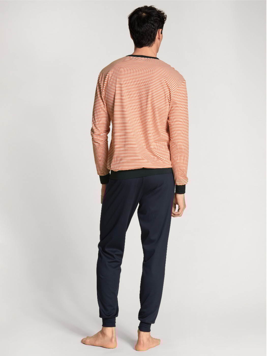 Men model is wearing Pyjama with cuff made of 100% Cotton in Red, Striped from the Nightwear Xtra series by CALIDA, Back view