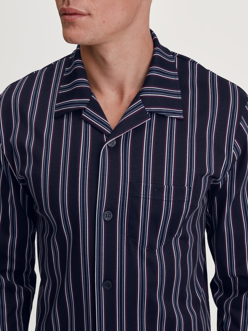 Men model is wearing Button-Up Pyjama made of 100% Cotton in Blue, Striped from the Relax Streamline 4 series by CALIDA, Detail