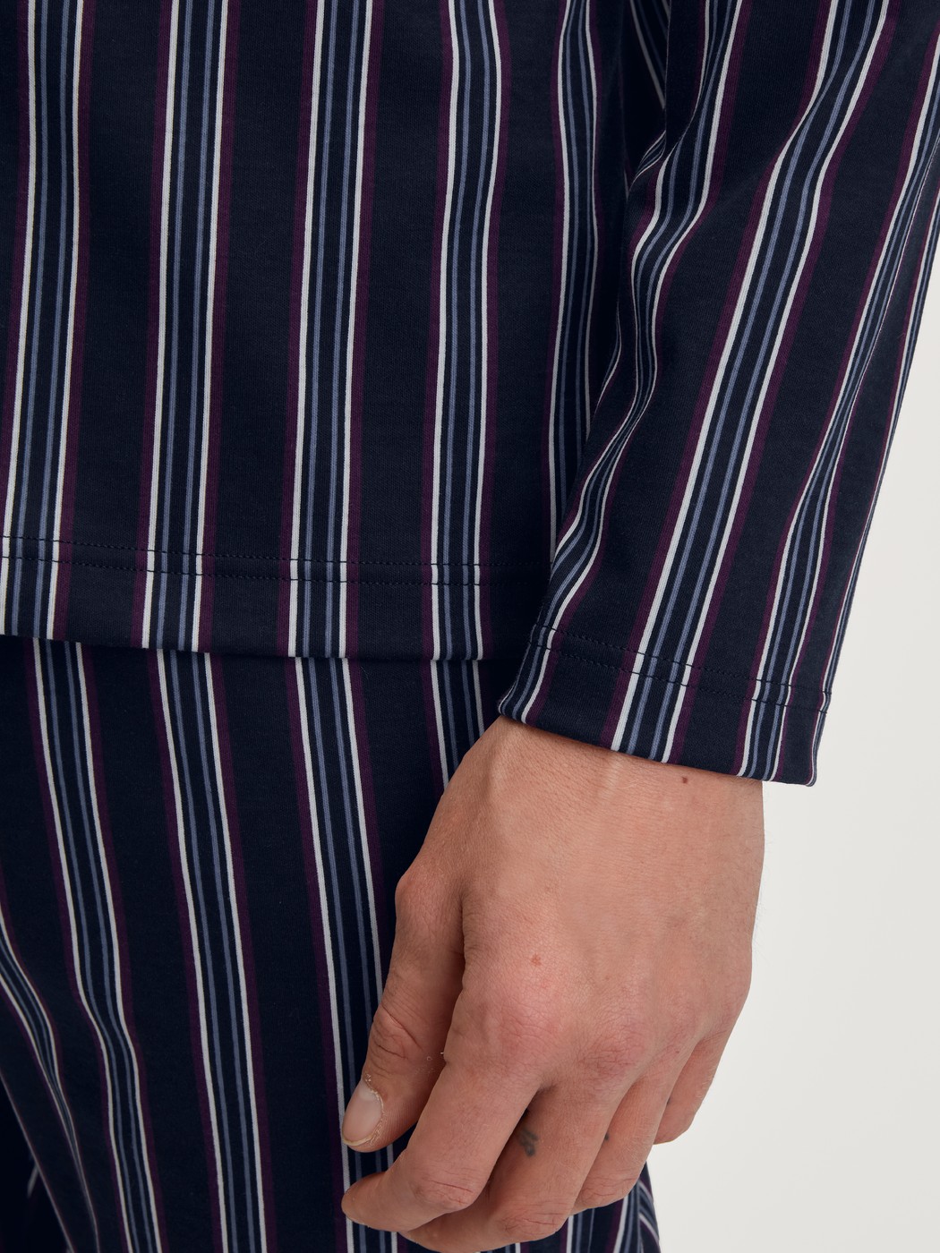 Men model is wearing Button-Up Pyjama made of 100% Cotton in Blue, Striped from the Relax Streamline 4 series by CALIDA, Detail