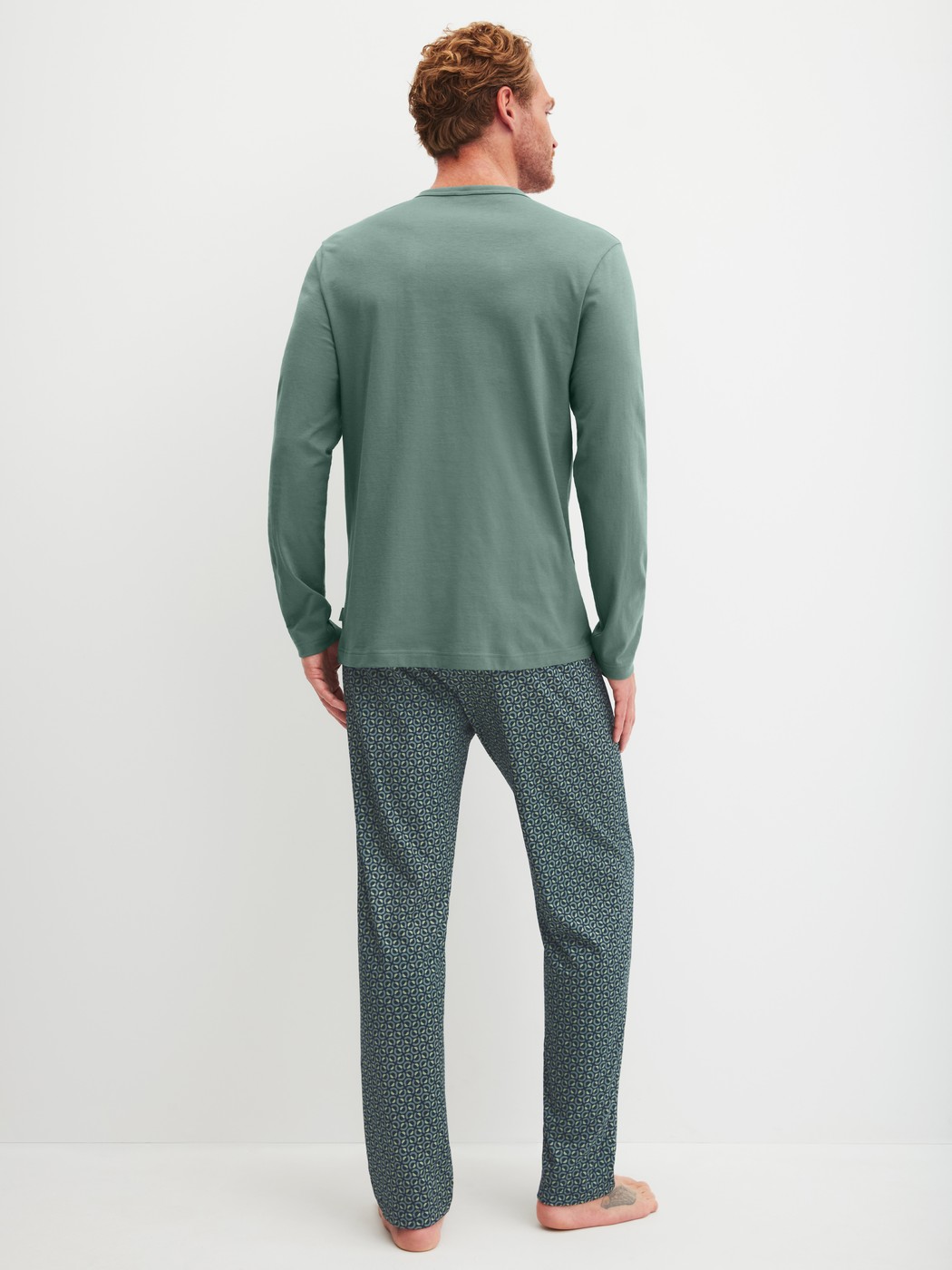 Men model is wearing Pyjamas, long made of 100% Cotton in Green, Patterned from the Cotton Special series by CALIDA, Back view