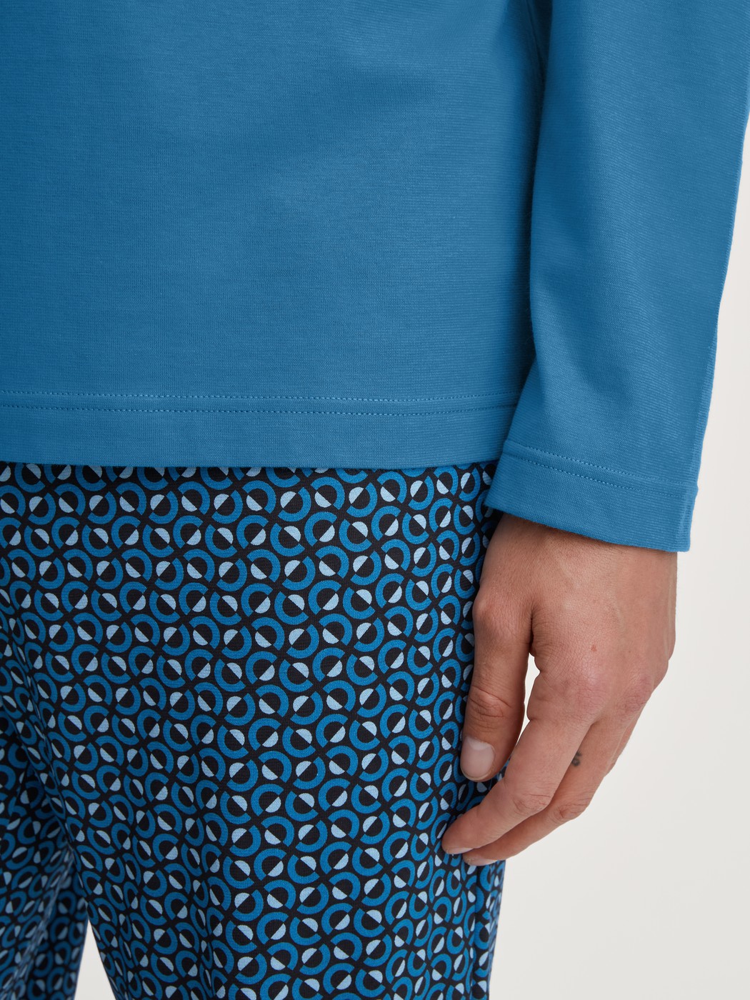 Men model is wearing Pyjamas, long made of 100% Cotton in Blue, Patterned from the Relax Imprint 2 series by CALIDA, Detail