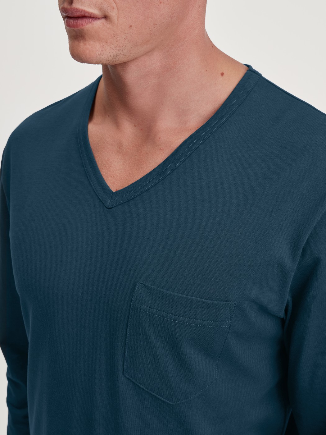 Men model is wearing Pyjamas, long made of 100% Cotton in Turquoise, Patterned from the Relax Imprint 3 series by CALIDA, Detail