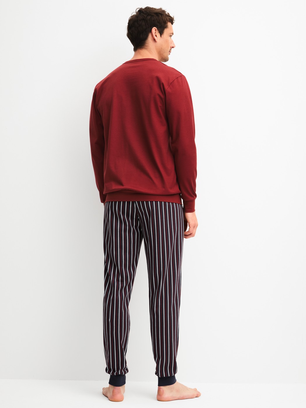Men model is wearing Pyjama with cuff made of 100% Cotton in Red, Striped from the Cotton Special series by CALIDA, Back view