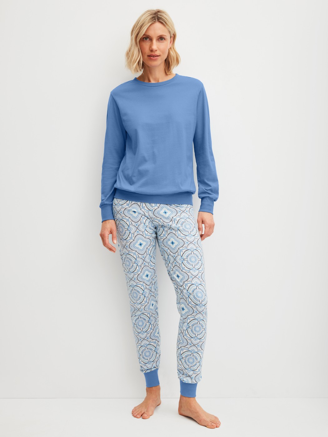 Women model is wearing Pyjama with cuff made of 100% Cotton in Blue, Patterned from the Cotton Special series by CALIDA, Front view