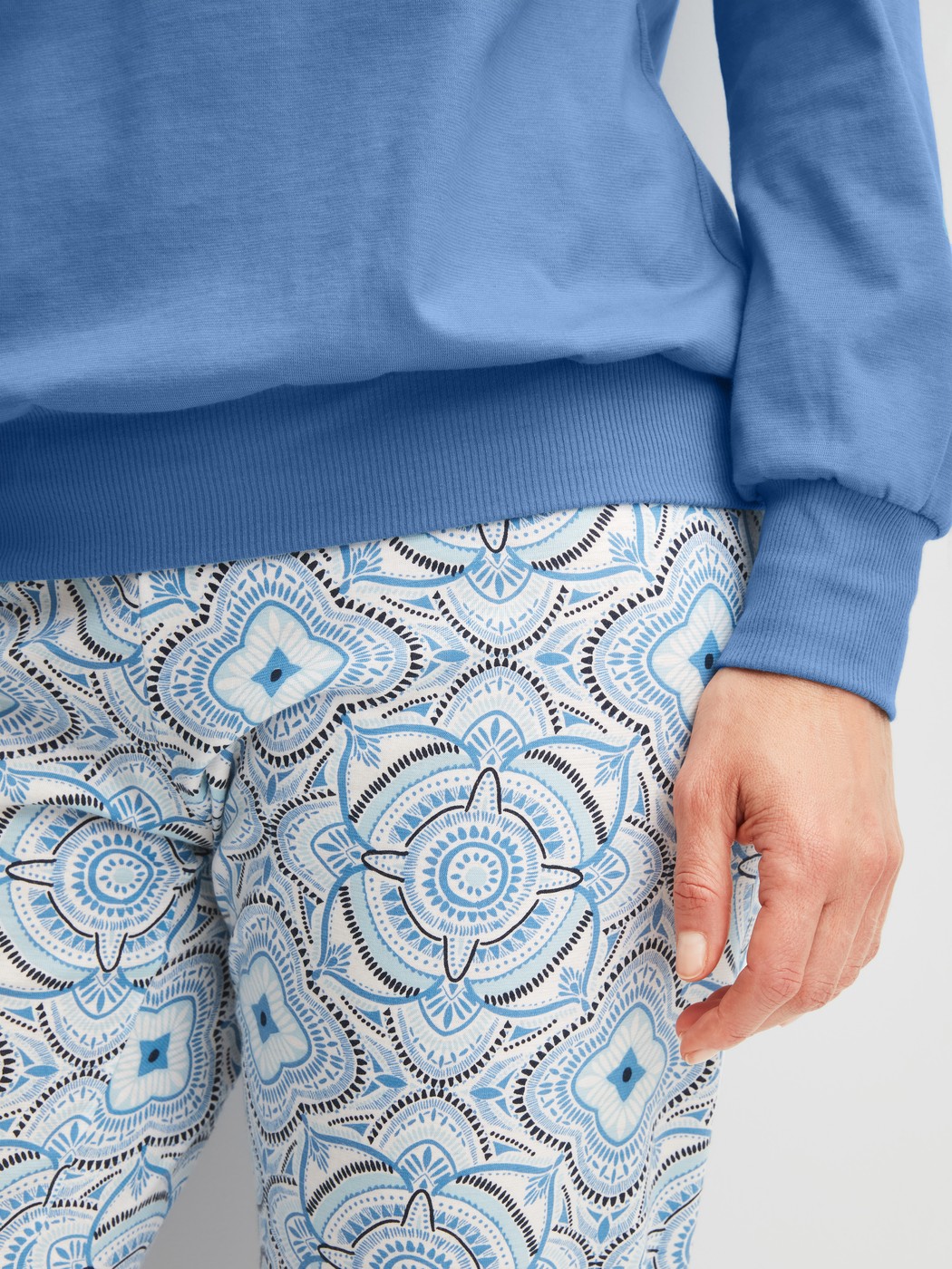 Women model is wearing Pyjama with cuff made of 100% Cotton in Blue, Patterned from the Cotton Special series by CALIDA, Detail