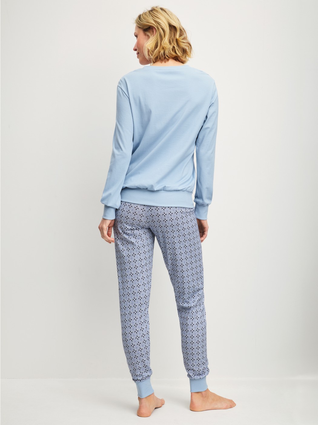 Women model is wearing Pyjama with cuff made of 100% Cotton in Grey, Patterned from the Cotton Special series by CALIDA, Back view