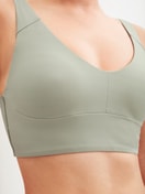 Damen-Model trägt Bustier mit verstellbaren Trägern aus Modal in Grün, Einfarbig aus Serie Natural Skin von CALIDA, Detail