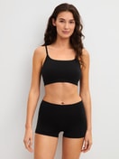 La modella / Il modello Donna indossa Bustier in Modal di colore Nero, Tinta unita, della serie Seamless Natural di CALIDA, Abbigliamento