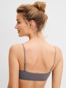 Women model is wearing Bustier made of Polyamide in Brown, Unicoloured from the Sleek Skin series by CALIDA, Back view