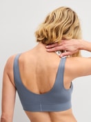Women model is wearing Bustier made of Cotton in Grey, Unicoloured from the Elastic series by CALIDA, Back view