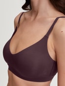 Women model is wearing Bustier with adjustable straps & removable pads made of Modal in Red, Unicoloured from the Natural Skin series by CALIDA, Detail